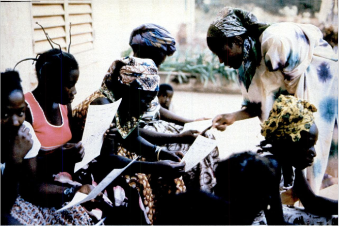 From the April 1979 Rotarian Magazine. Literacy class for girls in Africa sponsored by the World Bank.